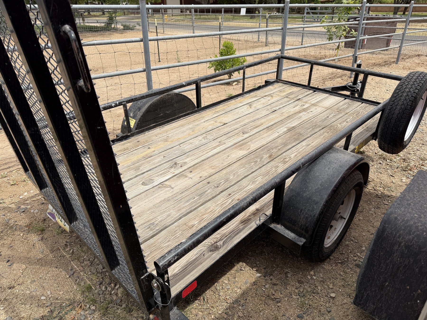 Wood deck and side rails of the utility trailer